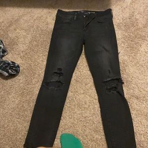 Black low rise ripped American eagle skinny jeans